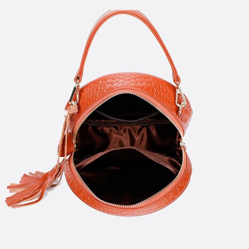 Round braided leather handbag